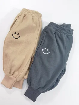 Versão coreana de novo para crianças de inverno, calças, meninos e meninas de moda de lã macia sorriso-vinculado casual calças