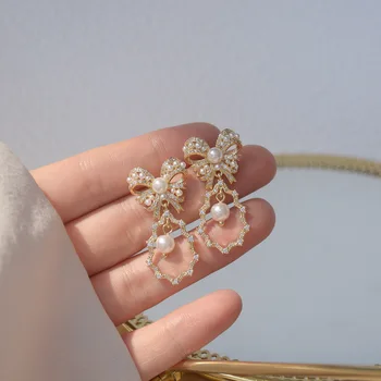 Coreia do sul um novo design, moda jóias doce e elegante arco de cobre zircão pérola gota de água feminino dangle brincos de